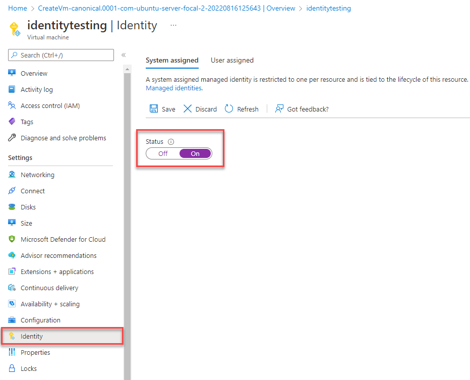Capture d’écran de Portail Azure page Identité de la ressource de machine virtuelle avec l’onglet Affecté par le système montrant et le champ État mis en surbrillance.