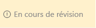 Zone jaune avec le texte En révision et une icône de danger