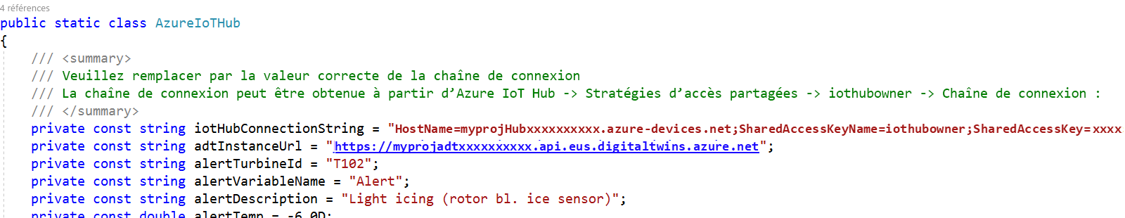 Screenshot of the Device Simulator solution with the Azure IoT Hub cs file open and host name and instance URL values added.