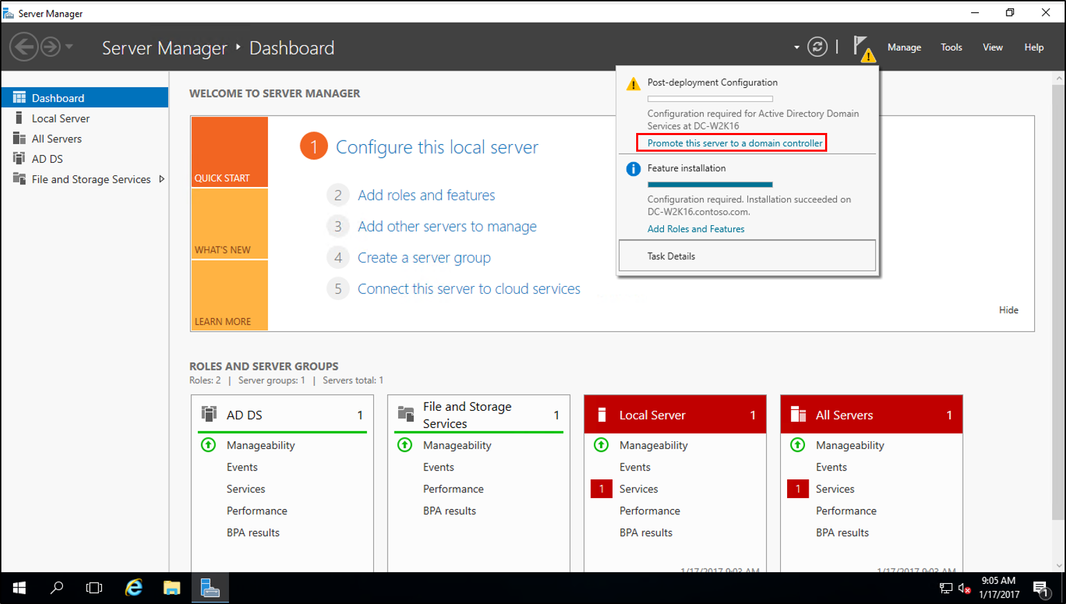 Screenshot of the Post-deployment Configuration progress dialog box with the Promote the server to a domain controller option called out.