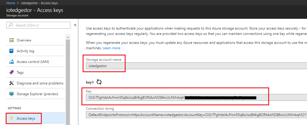Screenshot that shows the Access keys page, located under Settings. The Storage account name field and Key field are circled in red.