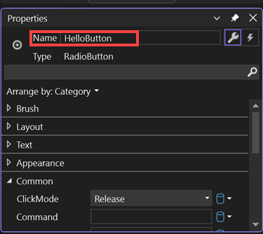 Screenshot of the Properties window for a RadioButton control with the value of the Name property changed to HelloButton.