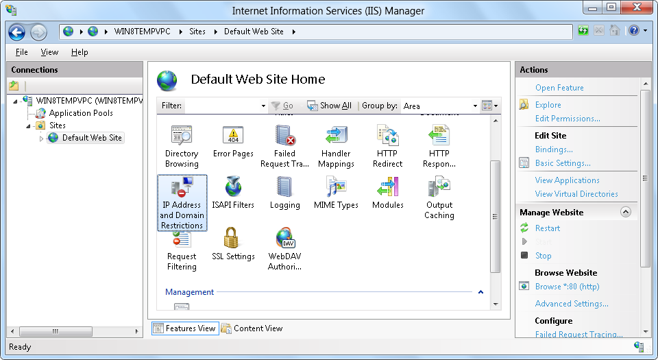 Cuplikan layar yang memperlihatkan Manajer I I S, dengan panel Beranda Situs Web Default terbuka dan Alamat I P dan Pembatasan Domain dipilih.