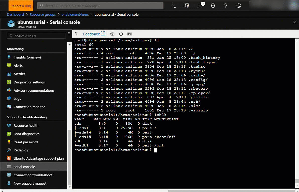 Animated GIF shows a command-line interface. The user selects Restart VM in the tool bar, and then the V M within Serial Console is restarted.