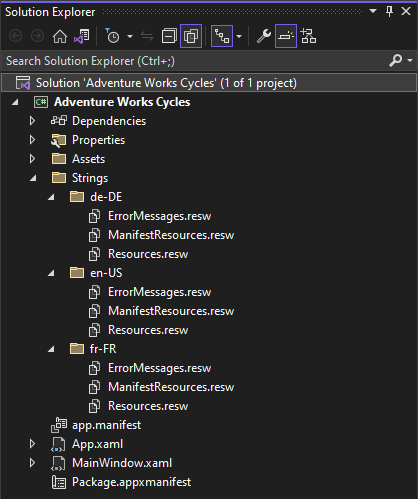 Cuplikan layar panel Solusi memperlihatkan folder Adventure Works Cycles > Strings dengan folder dan file lokal Jerman, Inggris U S, dan Prancis.