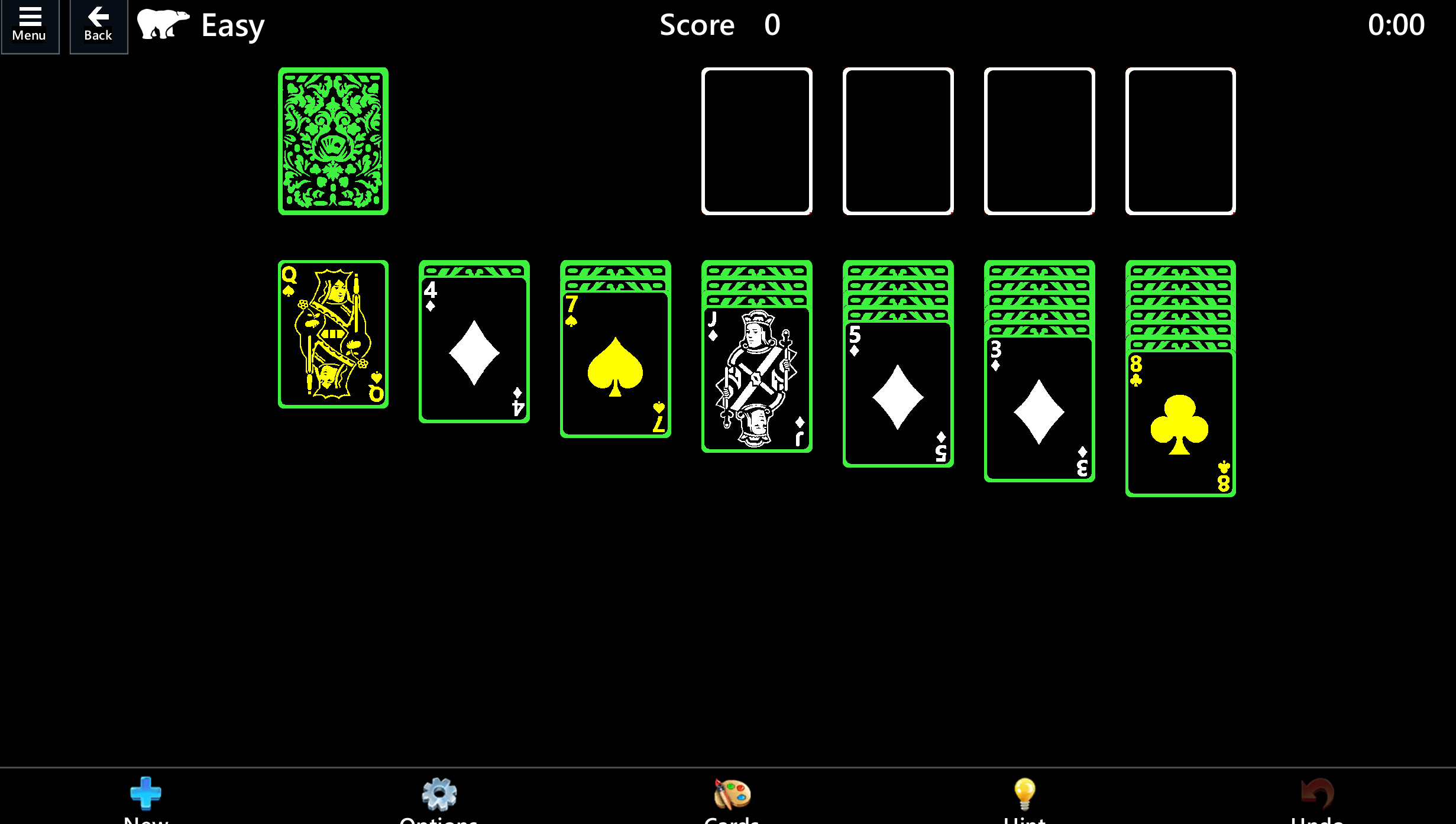ハイコントラストのソリティア ゲーム モード。 黒いカードは明るい緑色で縁取られ、黒いテーブルにどのカードが配置されているかを示す白いシンボルが描かれています。 カードの裏面には、緑豊かな複雑な模様が描かれています。