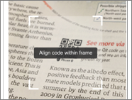 Power BI QR コードを指すスキャナーを示すニュース印刷のスクリーンショット。