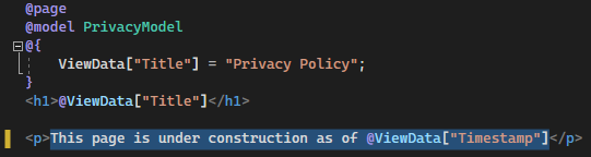 Visual Studio のコード エディターで、更新されたテキストが表示されている Privacy.cshtml ファイルが開かれているところを示すスクリーンショット。