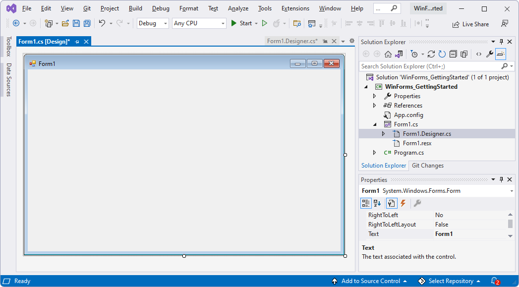 The Visual Studio window, showing the baseline WinForms project and a Forms Designer