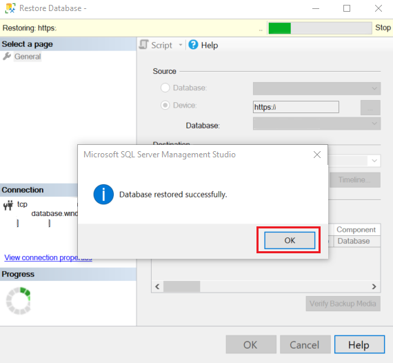 Screenshot of a dialog over a page in the **Restore** wizard. A message in the dialog indicates that the database was successfully restored.