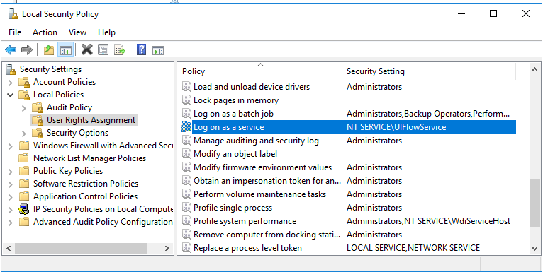 Screenshot shows UIFlowService is in log on as a service local security policy.