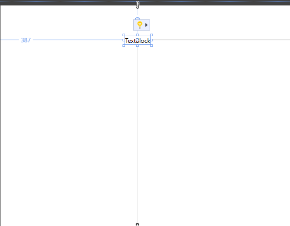 Zrzut ekranu przedstawiający kontrolkę TextBlock na powierzchni projektowej. Wskazówki są wyświetlane w przypadku pozycjonowania i zmiany rozmiaru kontrolki.
