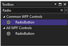 Zrzut ekranu przedstawiający okno Przybornik z kontrolką RadioButton wybraną na liście wspólnych kontrolek WPF.