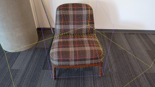 Photograph shows a chair with the bounding box, point cloud, and search area.