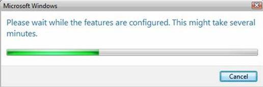 Captura de tela do indicador de progresso do Microsoft Windows. O texto diz Aguarde enquanto os recursos são configurados. Isso pode levar vários minutos.