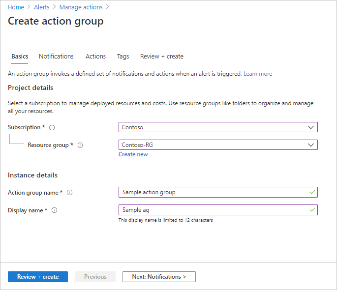 Screenshot that shows the Create action group dialog. Values are visible in the Subscription, Resource group, Action group name, and Display name boxes.