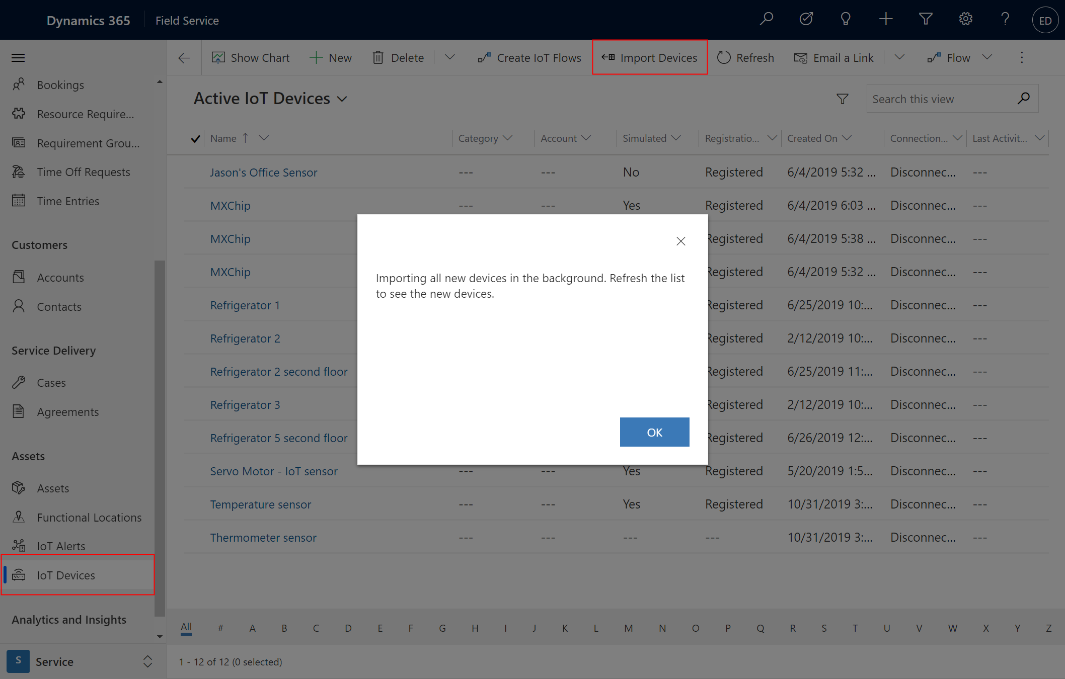 Captura de ecrã do Field Service na lista de Dispositivos IoT Ativos, a mostrar a mensagem de importação.