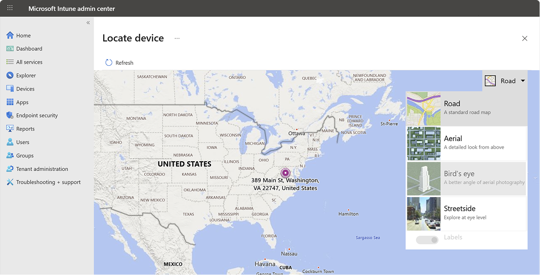 Map view showing the located device position with address and coordinates in the Intune admin center