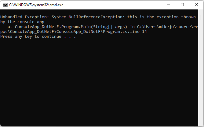 Screenshot of the console for ThrowsNullException.exe, which throws an unhandled null reference exception (System.NullReferenceException).