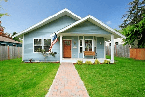 A blue house and the front yard