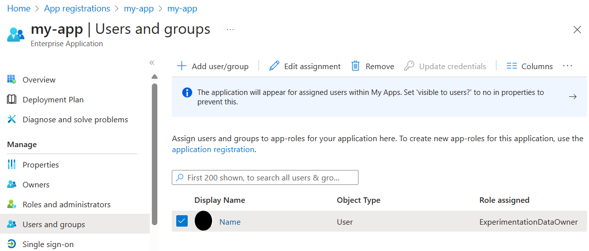 Screenshot of the Microsoft Entra admin center showing how to assign roles to users.