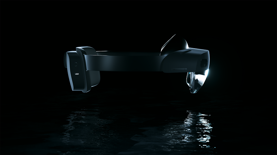 Photo of HoloLens 2 as reflected in a watery background.
