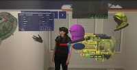 Photo of a HoloLens worker immersed in holograms.
