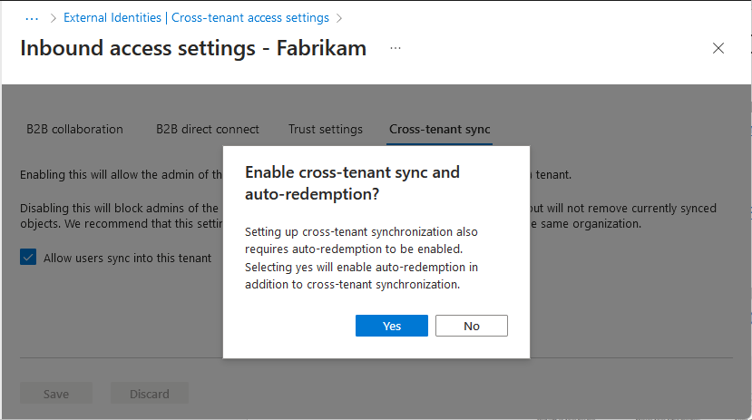 Screenshot that shows the Enable cross-tenant sync and auto-redemption dialog box to automatically redeem invitations in the target tenant.