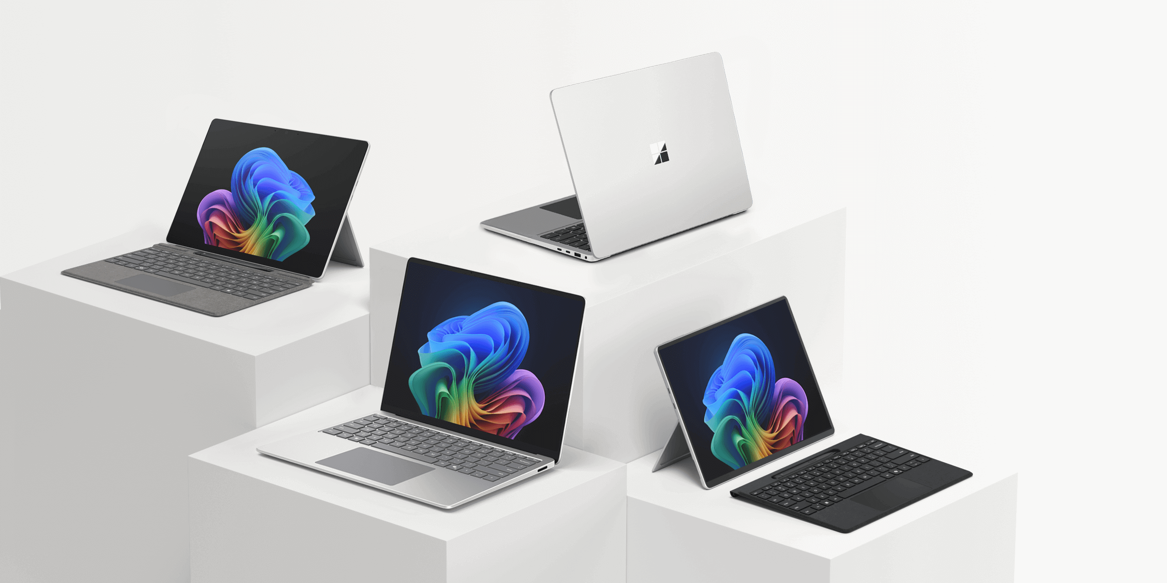 一張顯示 Surface 系列裝置的照片，包括 Surface Laptop 和 Surface Pro。